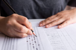 Student taking Private School Admissions Test - standardized test with bubbles.