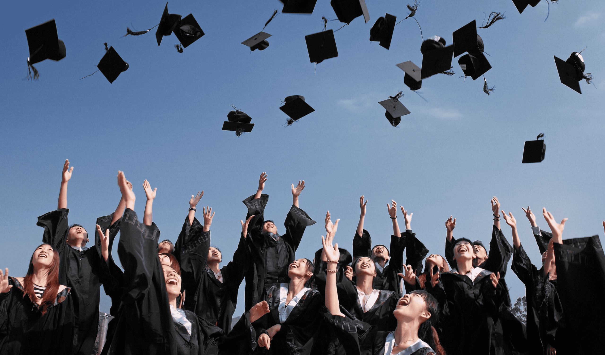 Student wearing cap and gown representing college admissions and graduation success