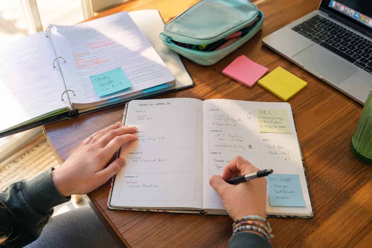 Parkland executive function coaching - student organizing assignments in a weekly planner, one of the ways families are served by Diversified Education Services executive function coaching