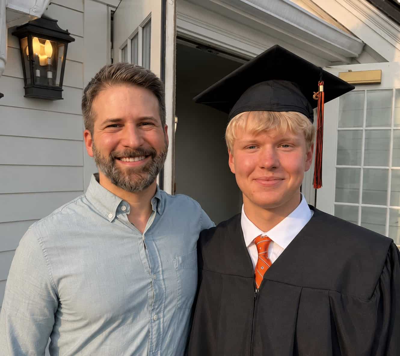 Aron Boxer, founder of Diversified Education Services, smiling with a DES student in cap and gown at his 2026 high school graduation