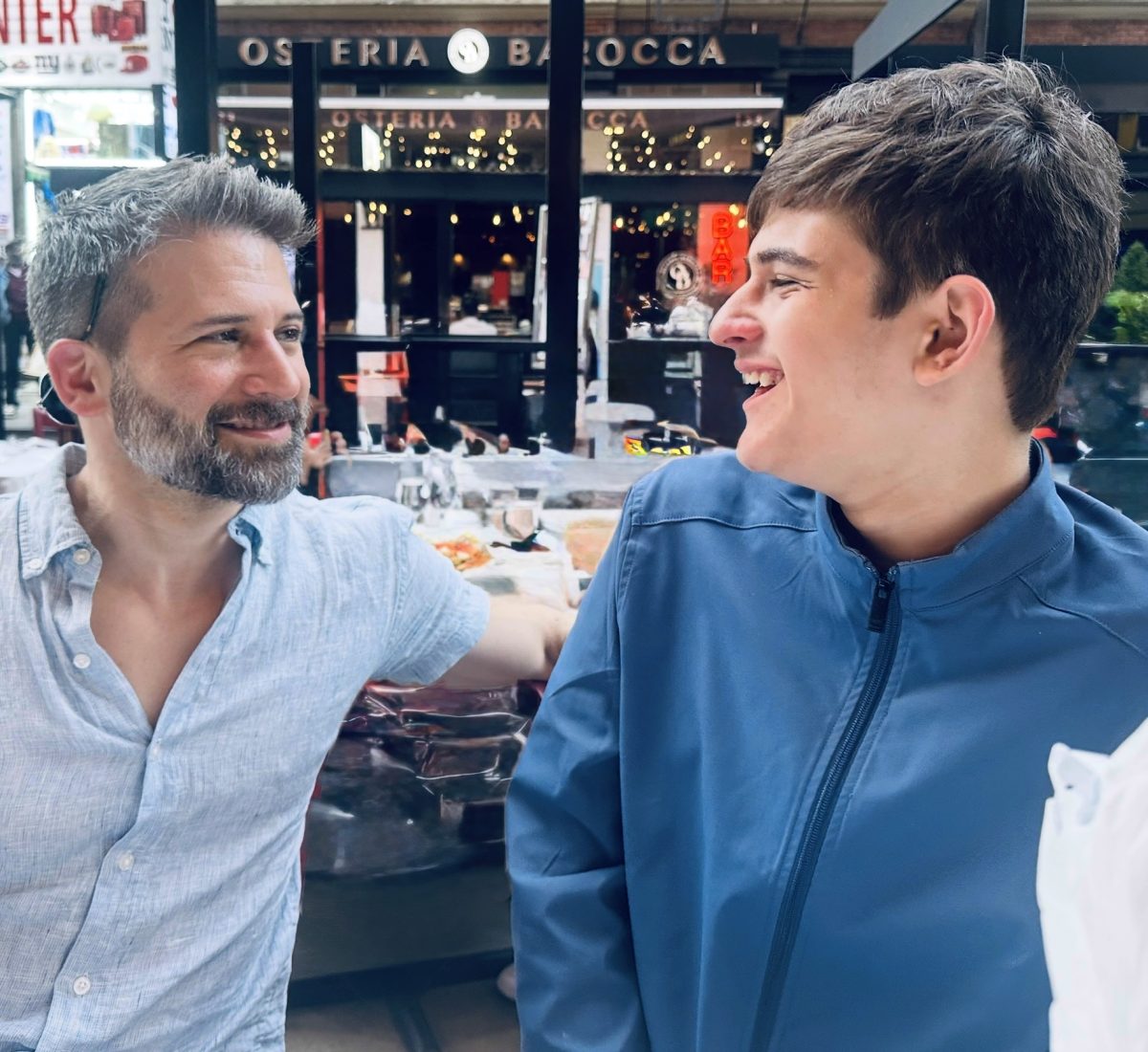 Aron Boxer smiling with his stepson Dylan, who has autism.